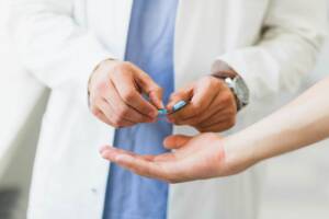 Oral medications - A doctor Giving some medicines to a patient