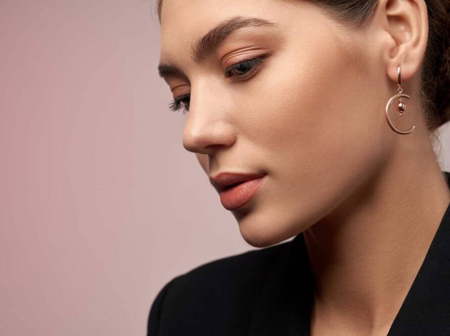 women Showing her ear pircing with beautiful earring